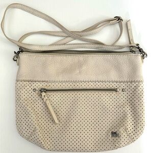 The Sak leather perforated messenger bag bone